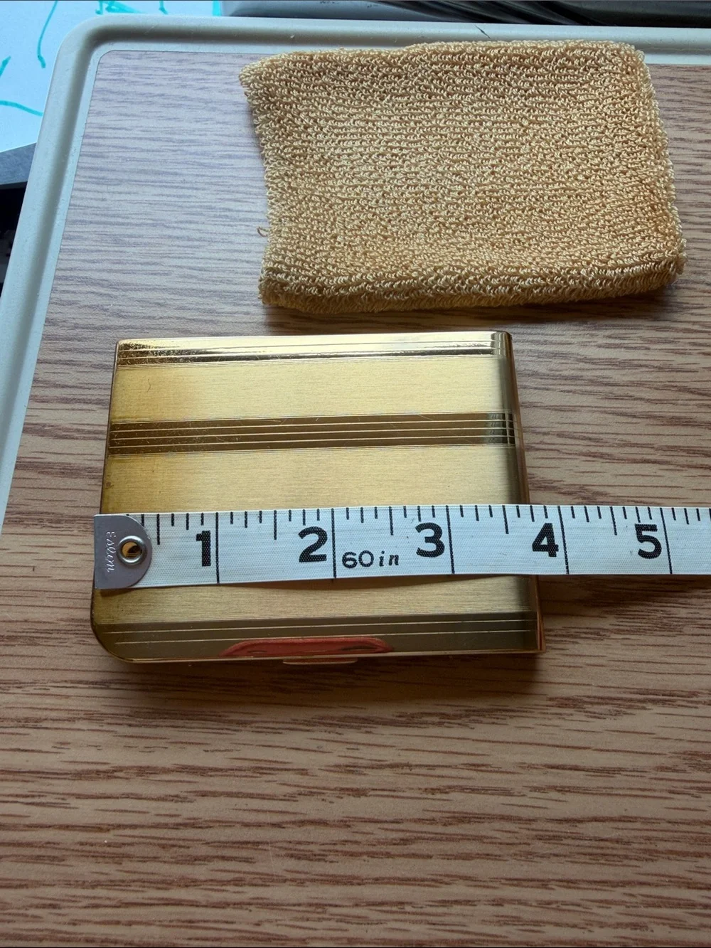 Vintage Elgin American cigarette case features a striking striped gold pattern